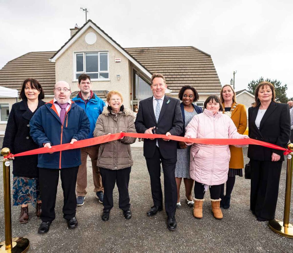 Group-of-people-cutting-the-ribbon-at-opening-of-Prosper-Fingal-Balustree-House-Residential--Service